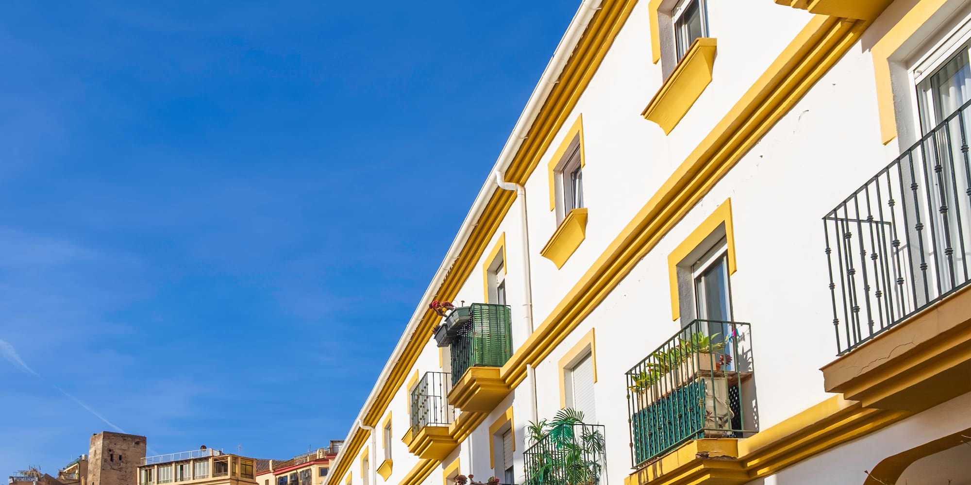a white building with yellow trim