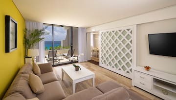 a living room with a glass door and a couch