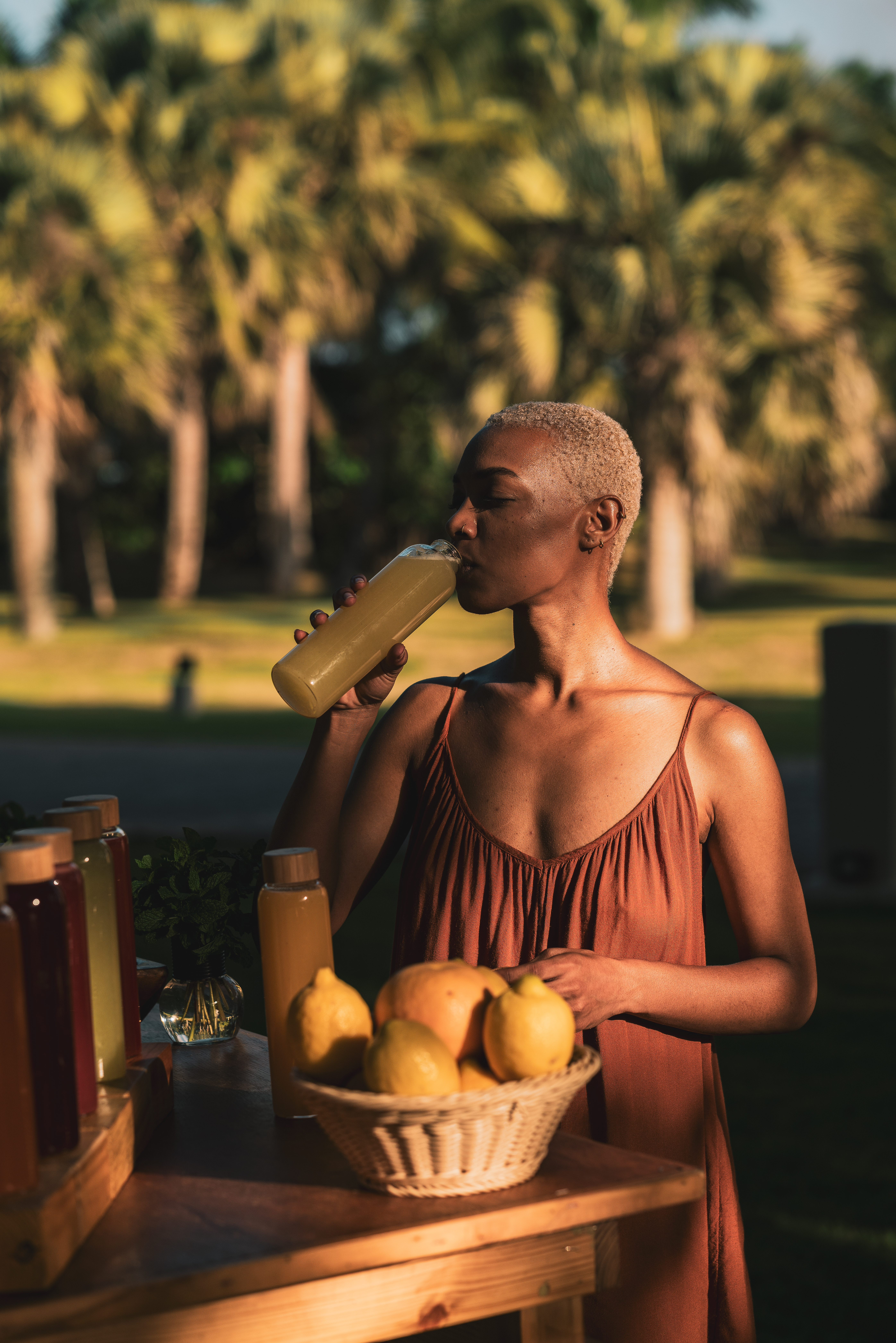 a woman drinking from a bottle