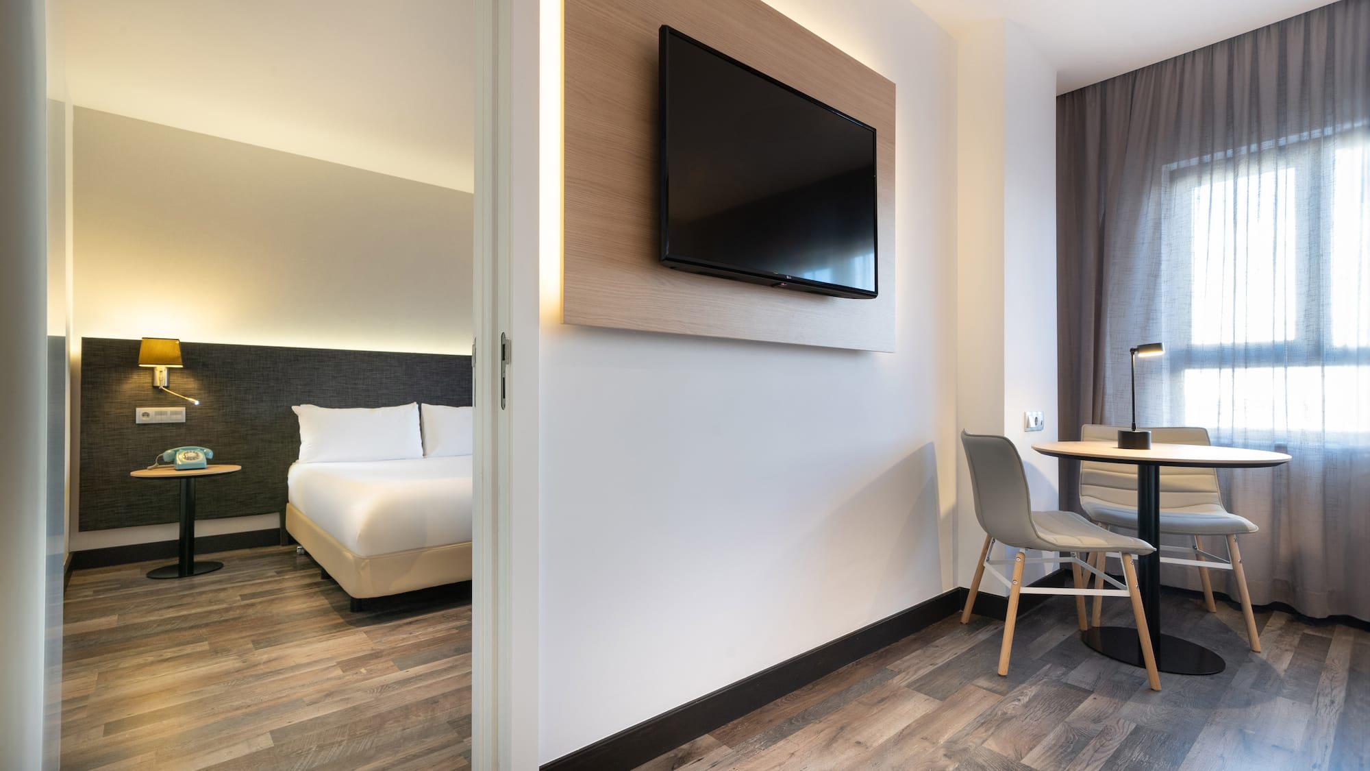 a room with a tv on the wall