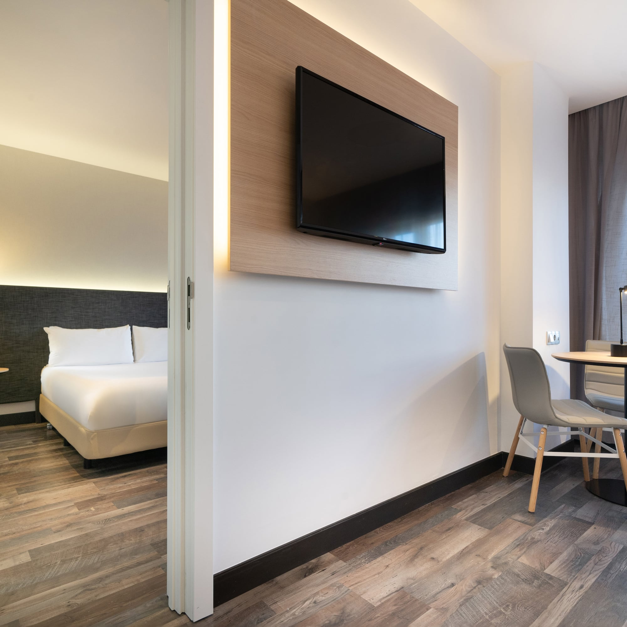 a room with a tv on the wall