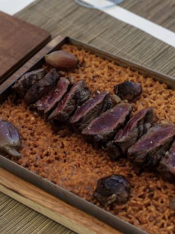 a plate of meat and rice