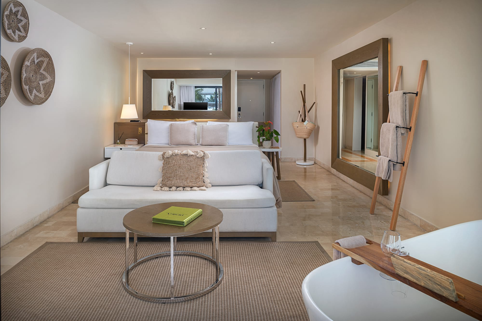 a room with a bed and a mirror