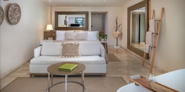 a room with a bed and a mirror