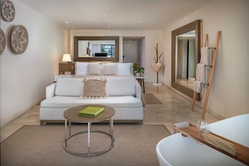 a room with a bed and a mirror