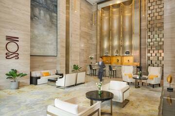 a man walking in a hotel lobby