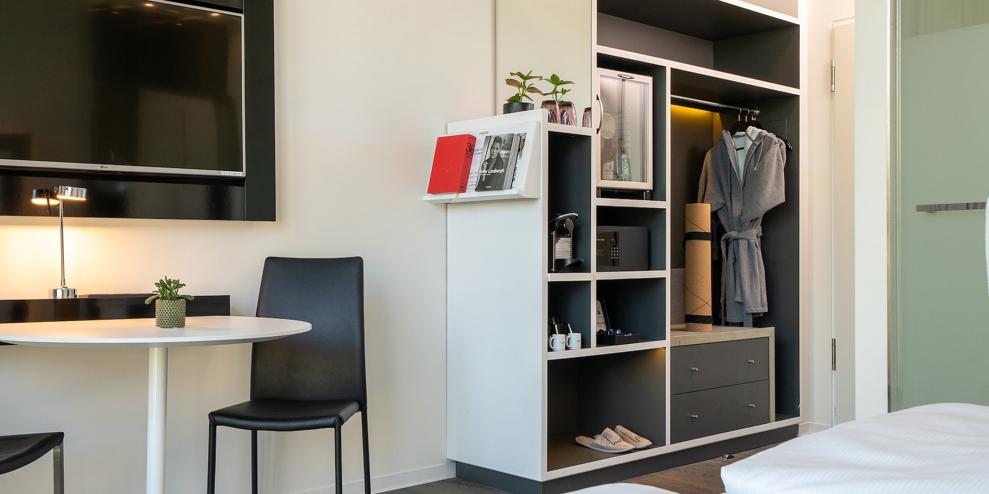 a room with a tv and a table