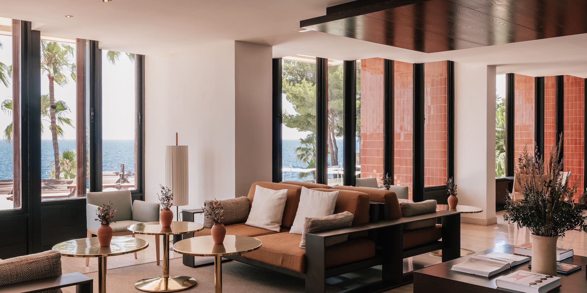 a room with a couch and tables