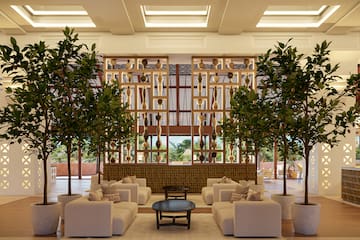 a room with a couch and trees