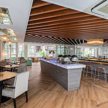 a restaurant with a bar and chairs