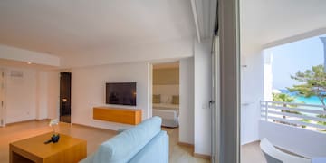 a living room with a tv and a couch