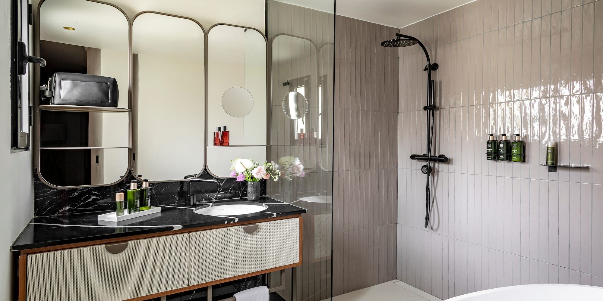 a bathroom with a shower and sink