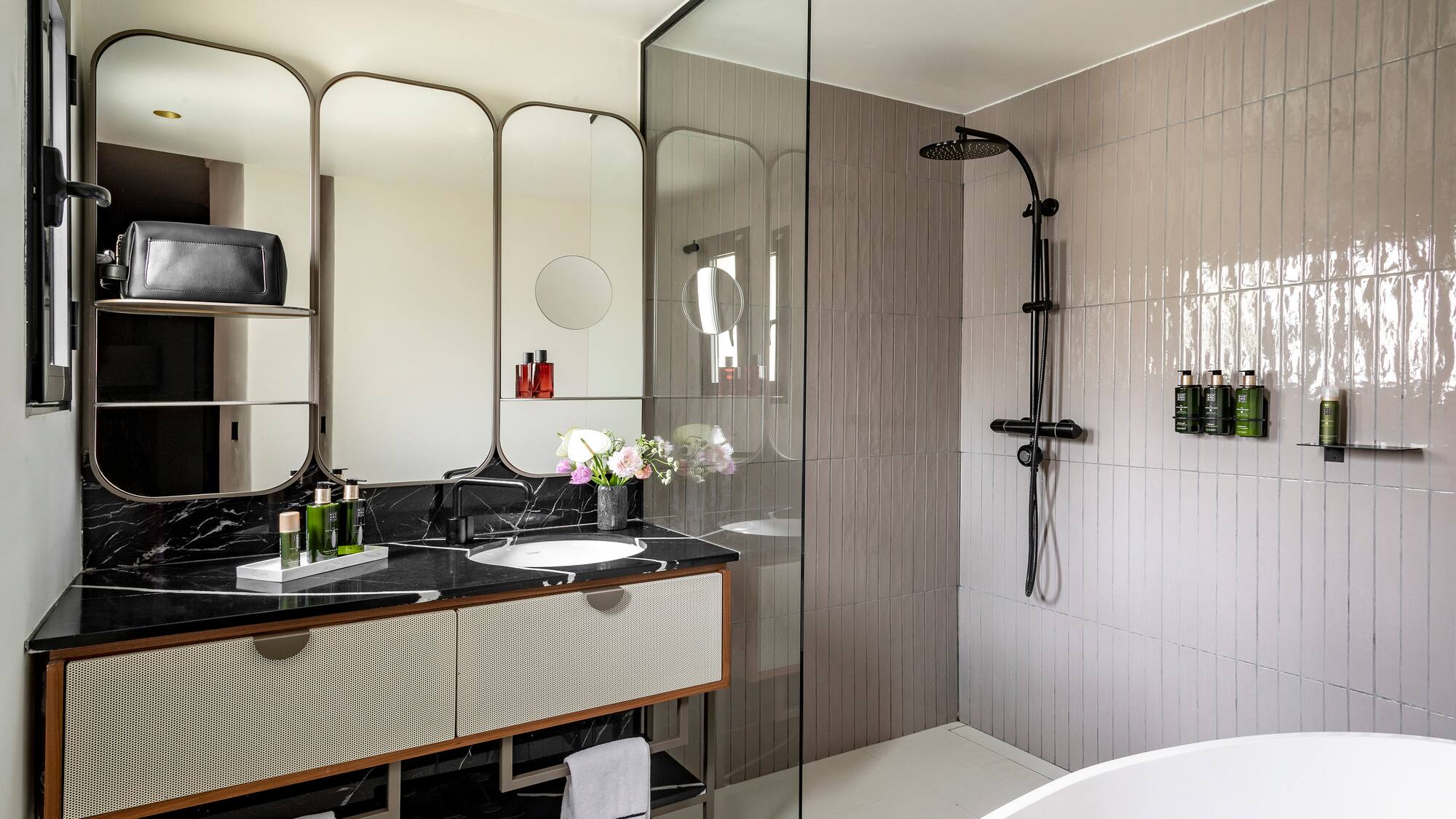 a bathroom with a shower and sink