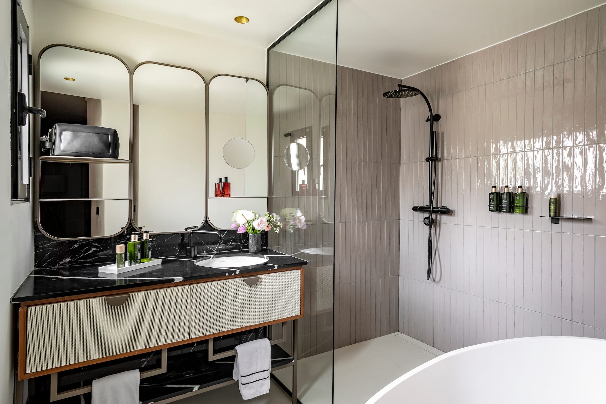 a bathroom with a shower and sink