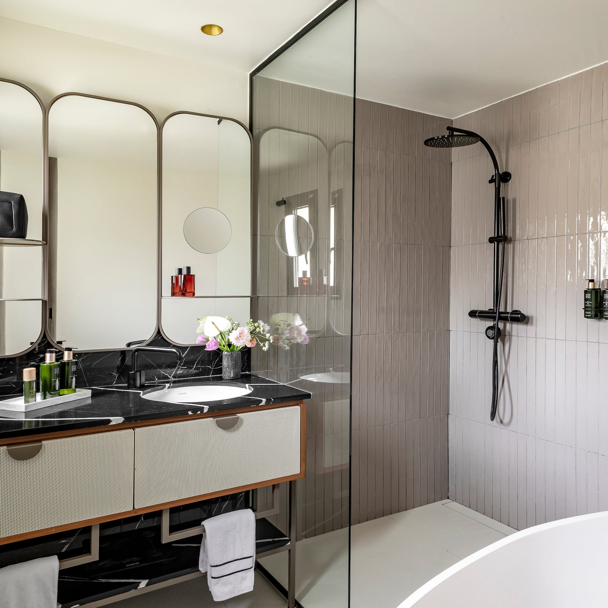 a bathroom with a shower and sink