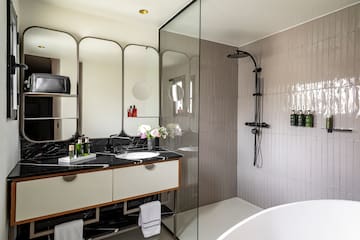 a bathroom with a shower and sink