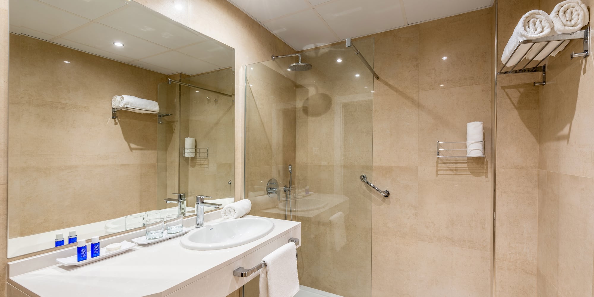 a bathroom with a shower and sink