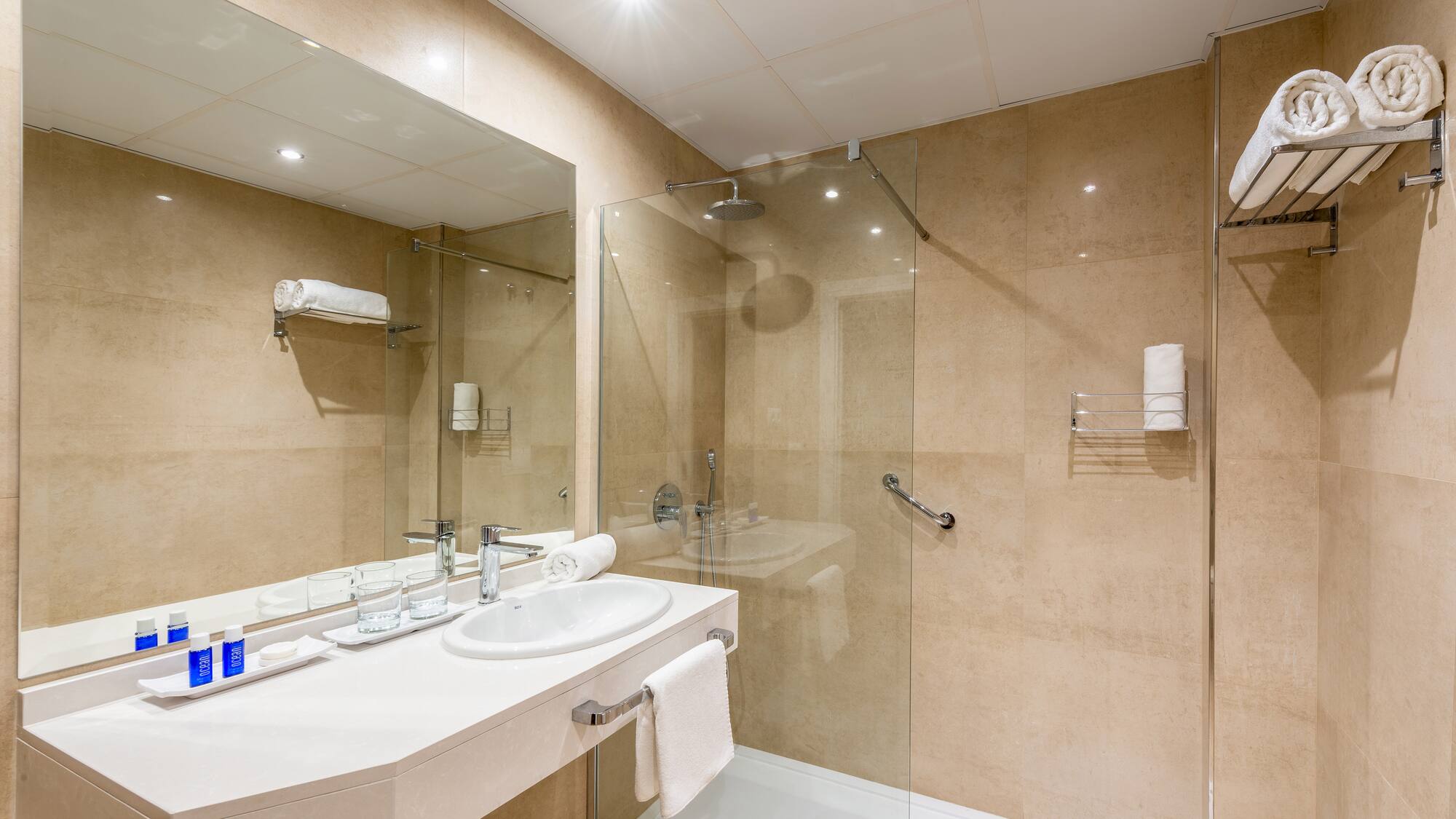 a bathroom with a shower and sink