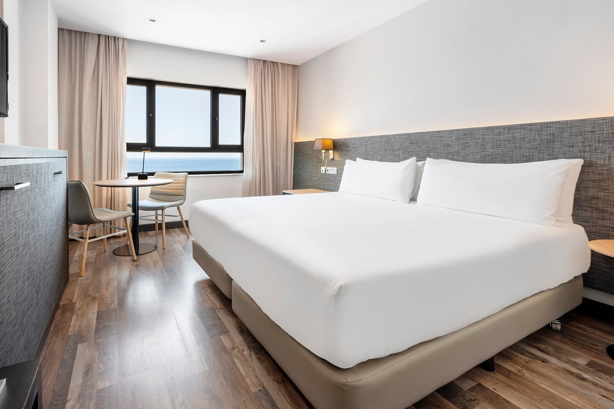 a room with a bed and a table