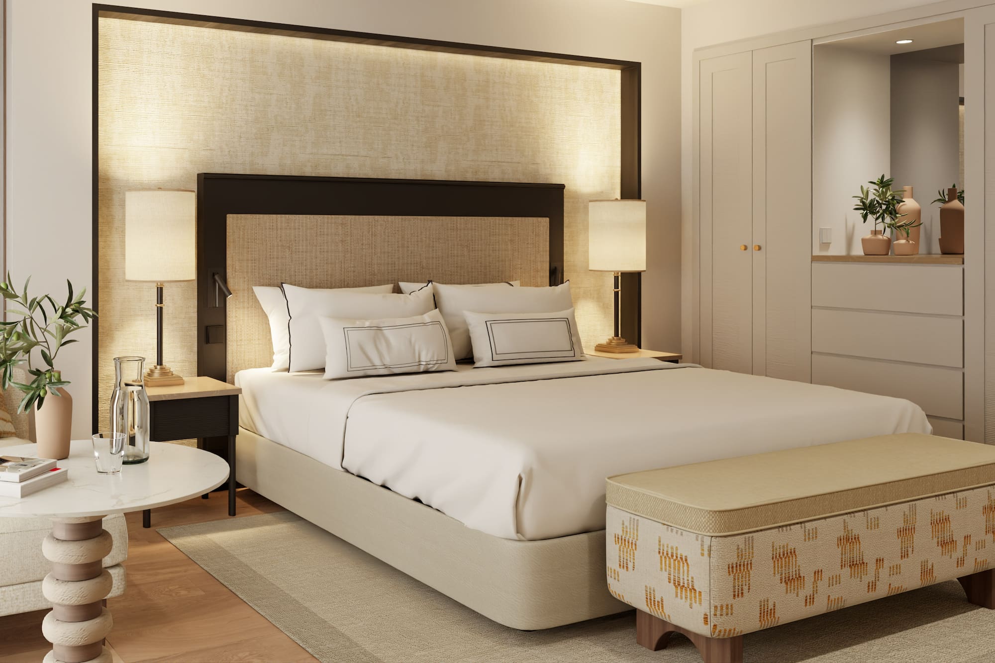 a bed with a headboard and a table with lamps