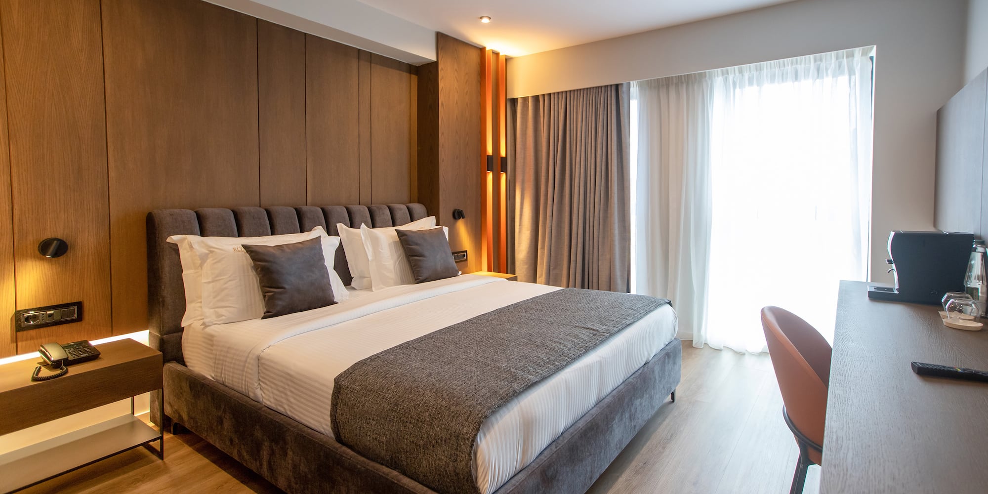 a bed with pillows in a room