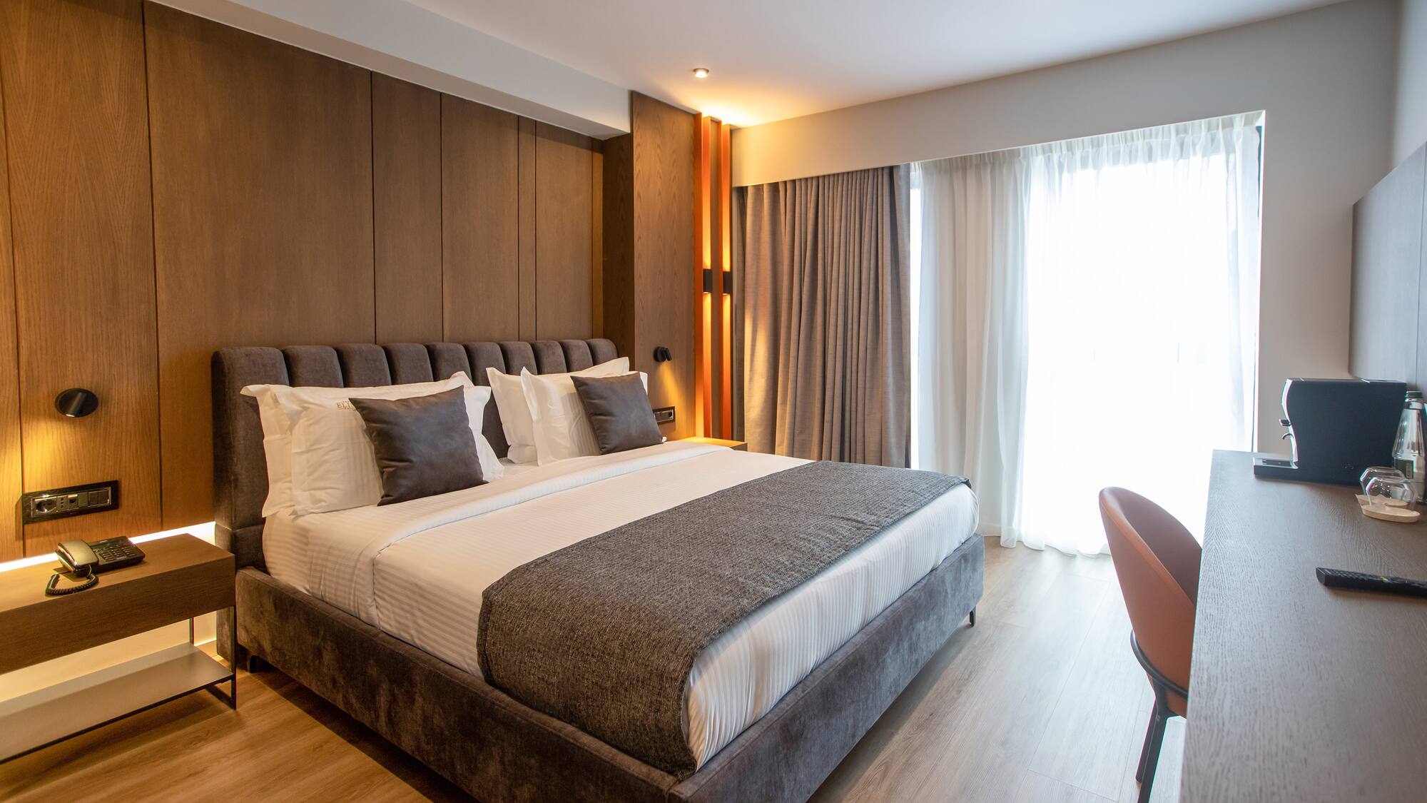 a bed with pillows in a room