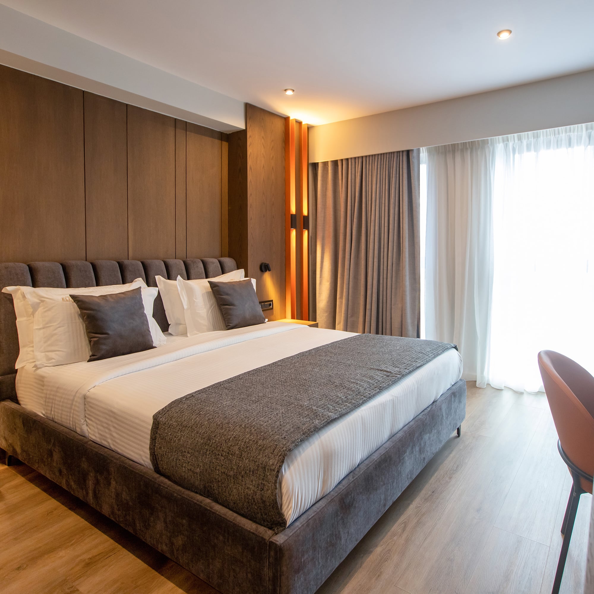 a bed with pillows in a room