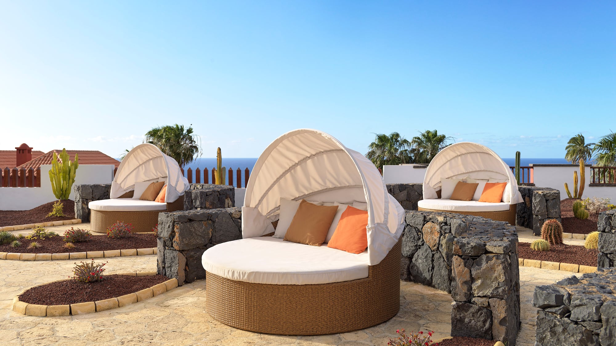 a group of chairs with a canopy