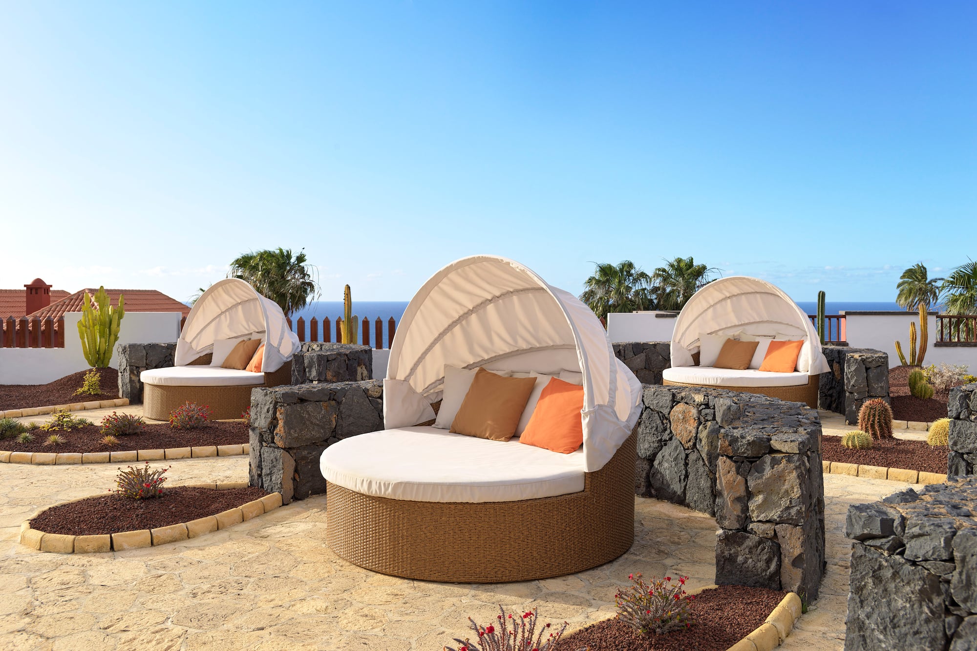 a group of chairs with a canopy