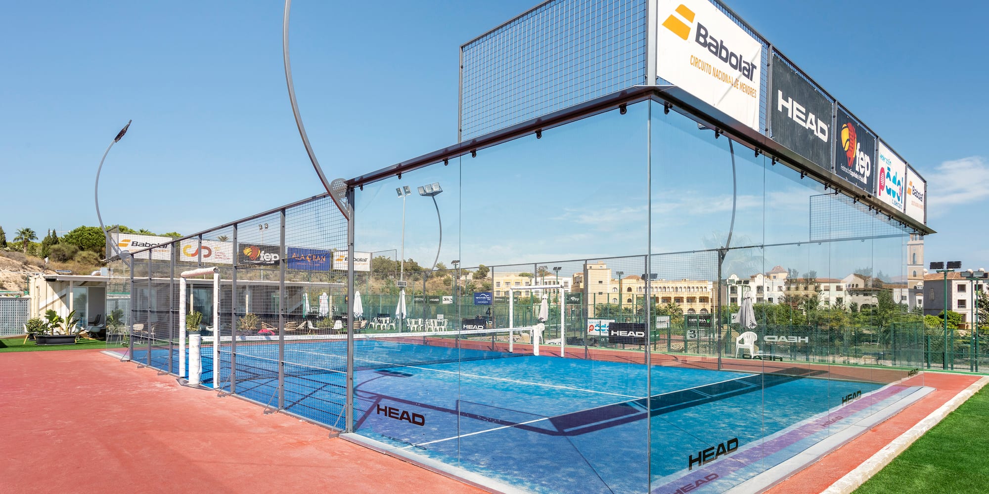 a glass tennis court with a net