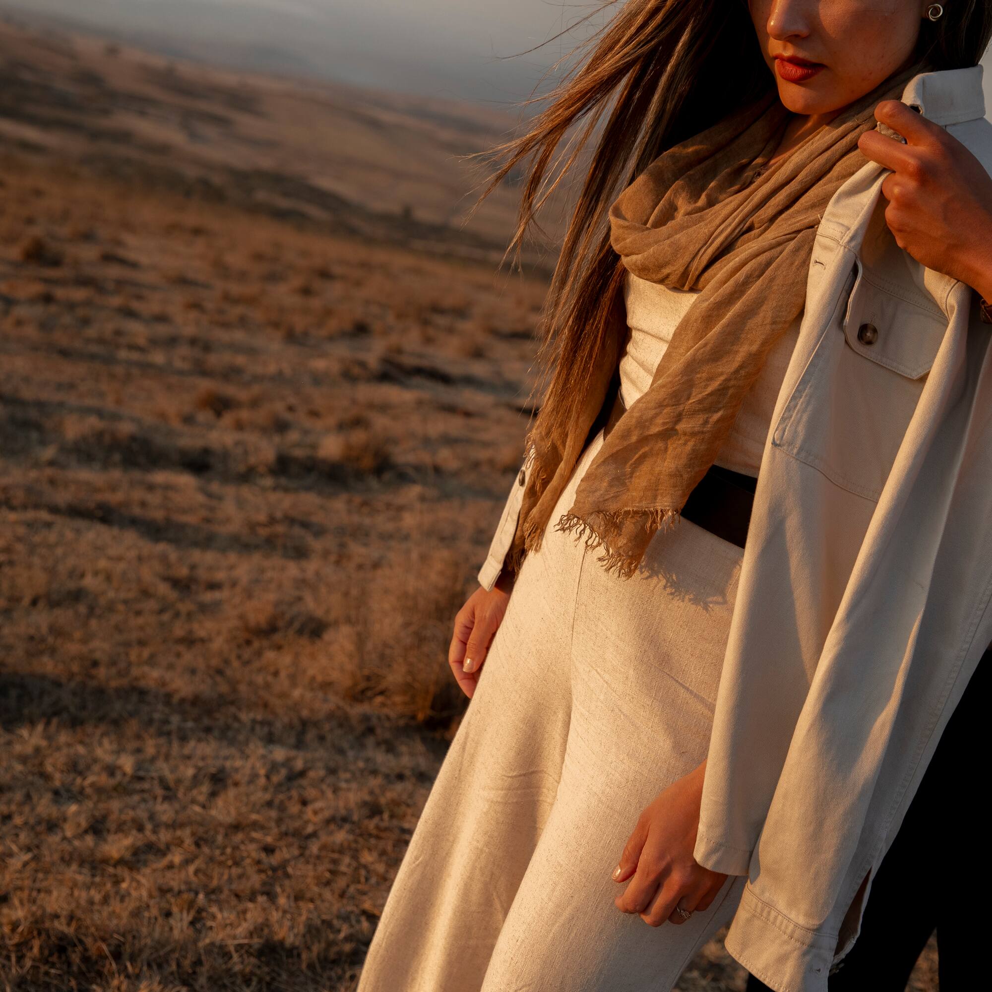 a woman standing in a field
