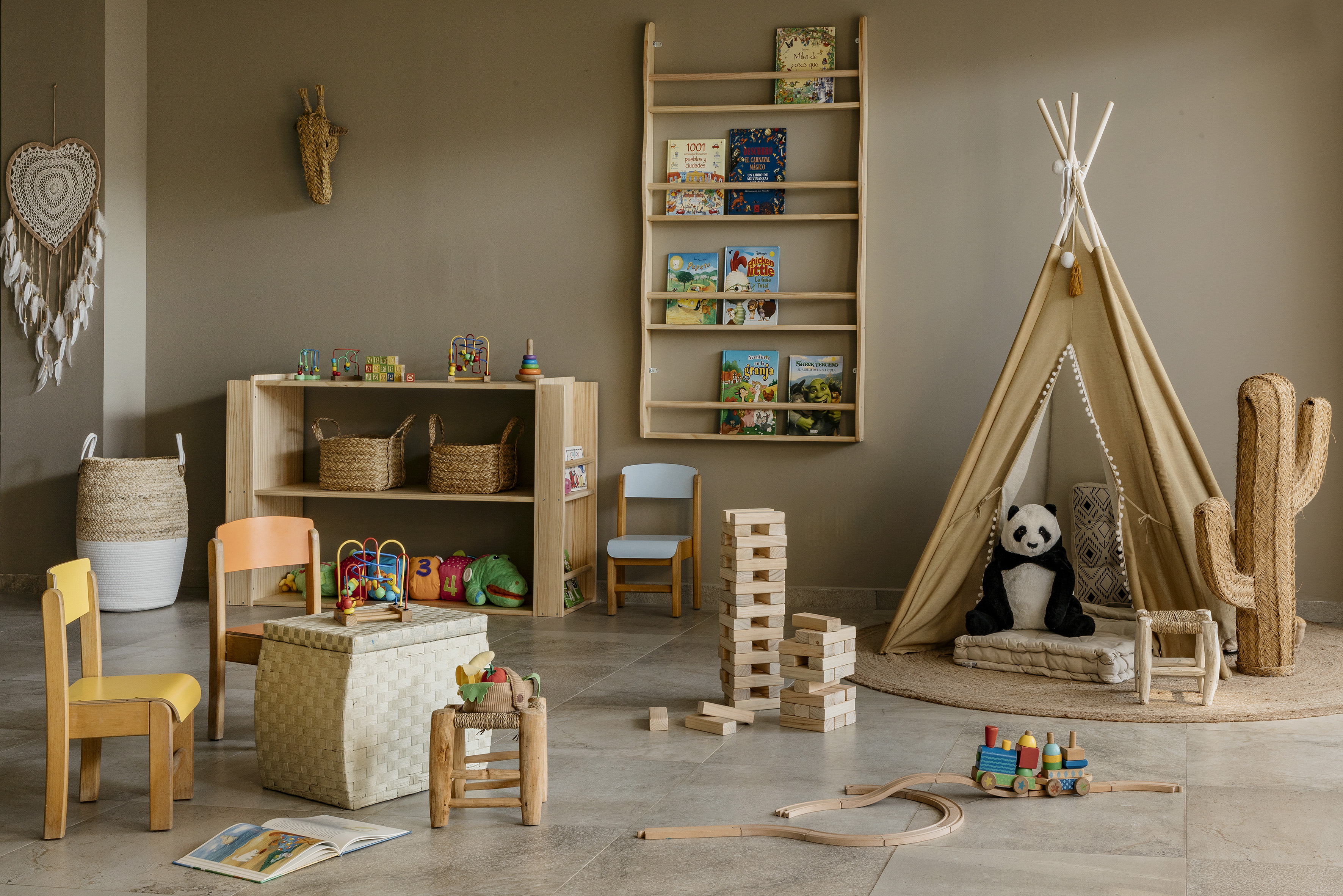 Cozy children's playroom with wooden toys, teepee, books, and natural decor.