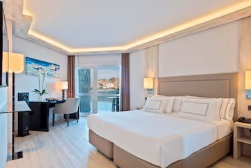 a bedroom with a bed and a desk and chair