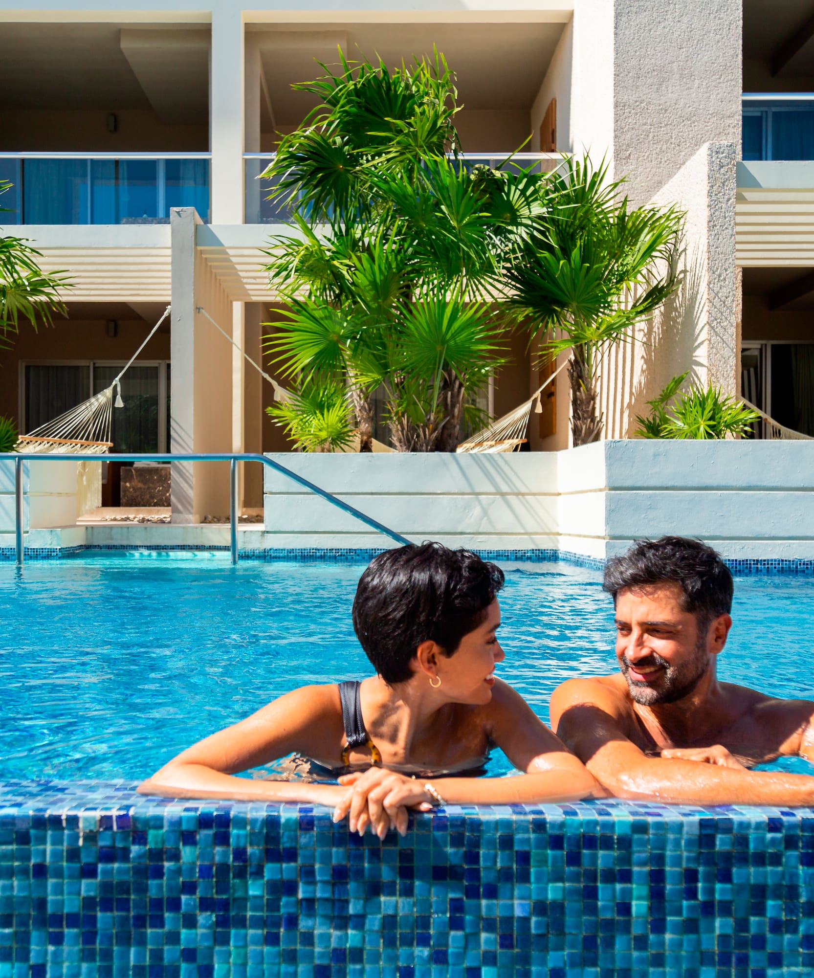 a man and woman in a pool