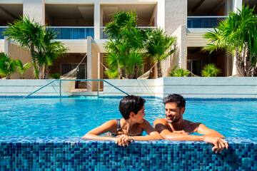 a man and woman in a pool