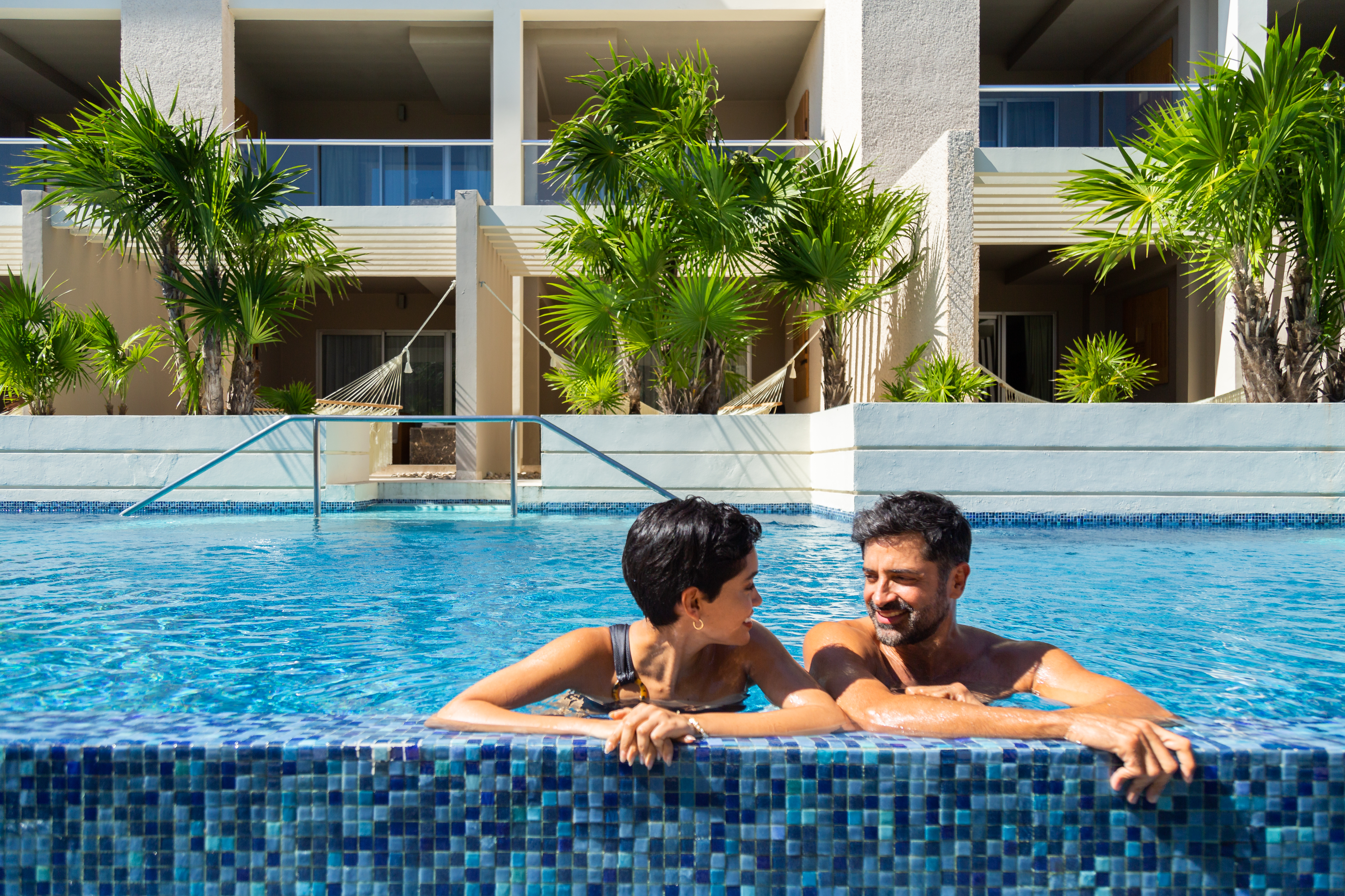 a man and woman in a pool