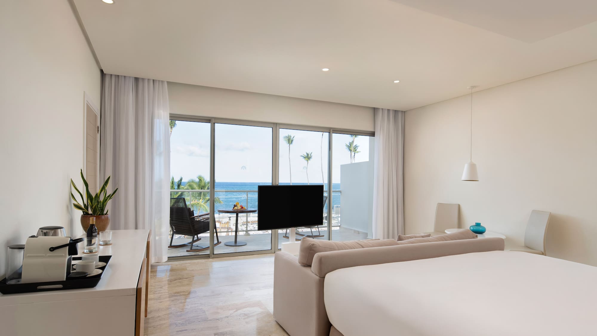 a room with a television and a large window