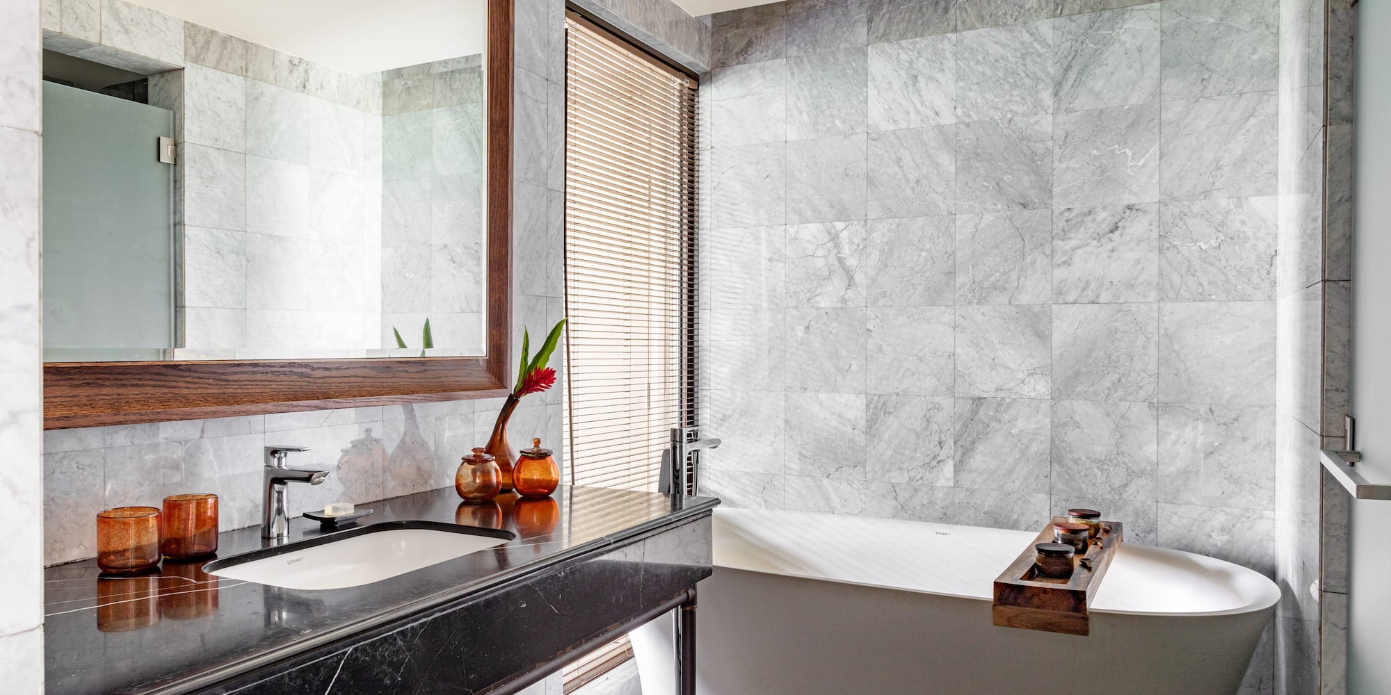 a bathroom with a bathtub and sink