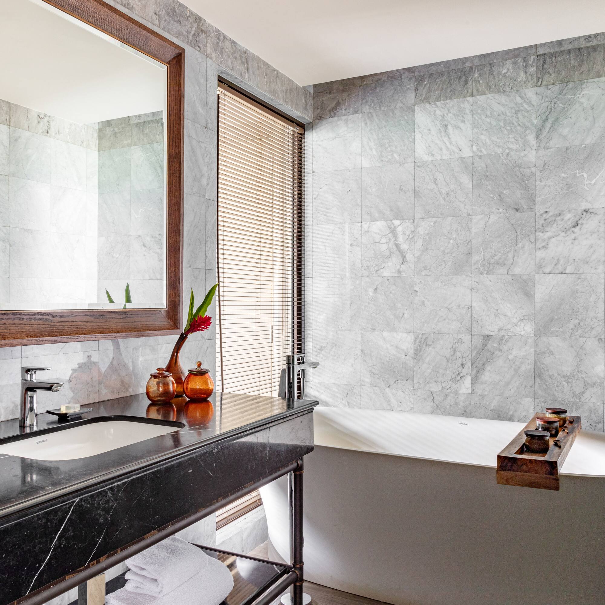 a bathroom with a bathtub and sink
