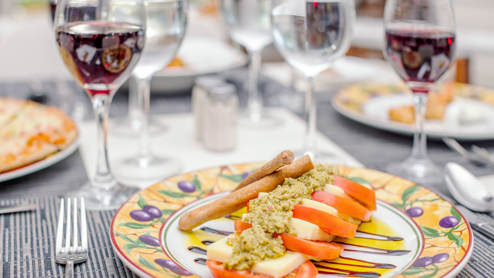 a plate of food and wine glasses