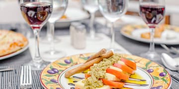 a plate of food and wine glasses
