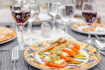 a plate of food and wine glasses