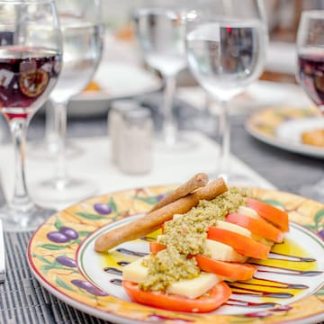 a plate of food and wine glasses
