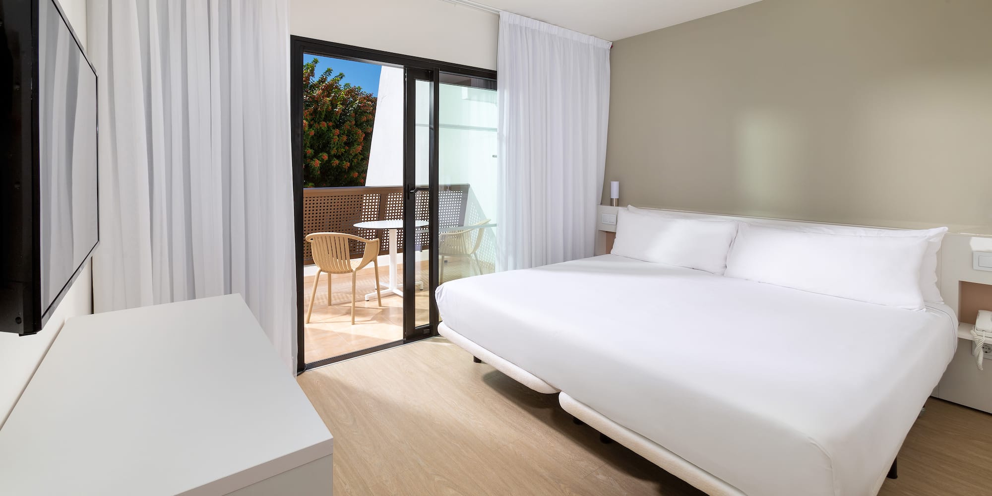 a room with a bed and a glass door