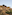 a stone building on a hill