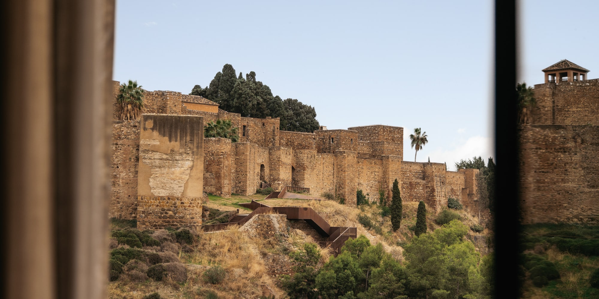 a stone building on a hill