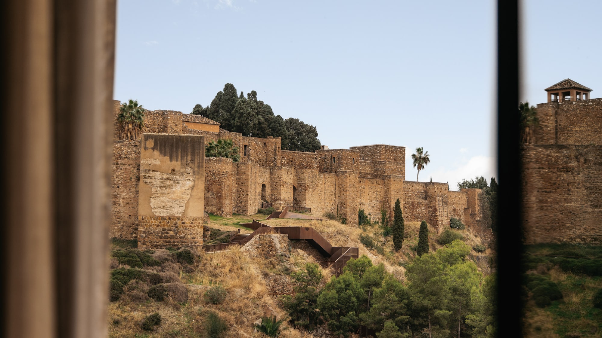 a stone building on a hill