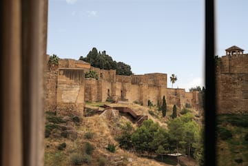 a stone building on a hill