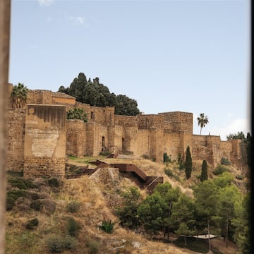 a stone building on a hill