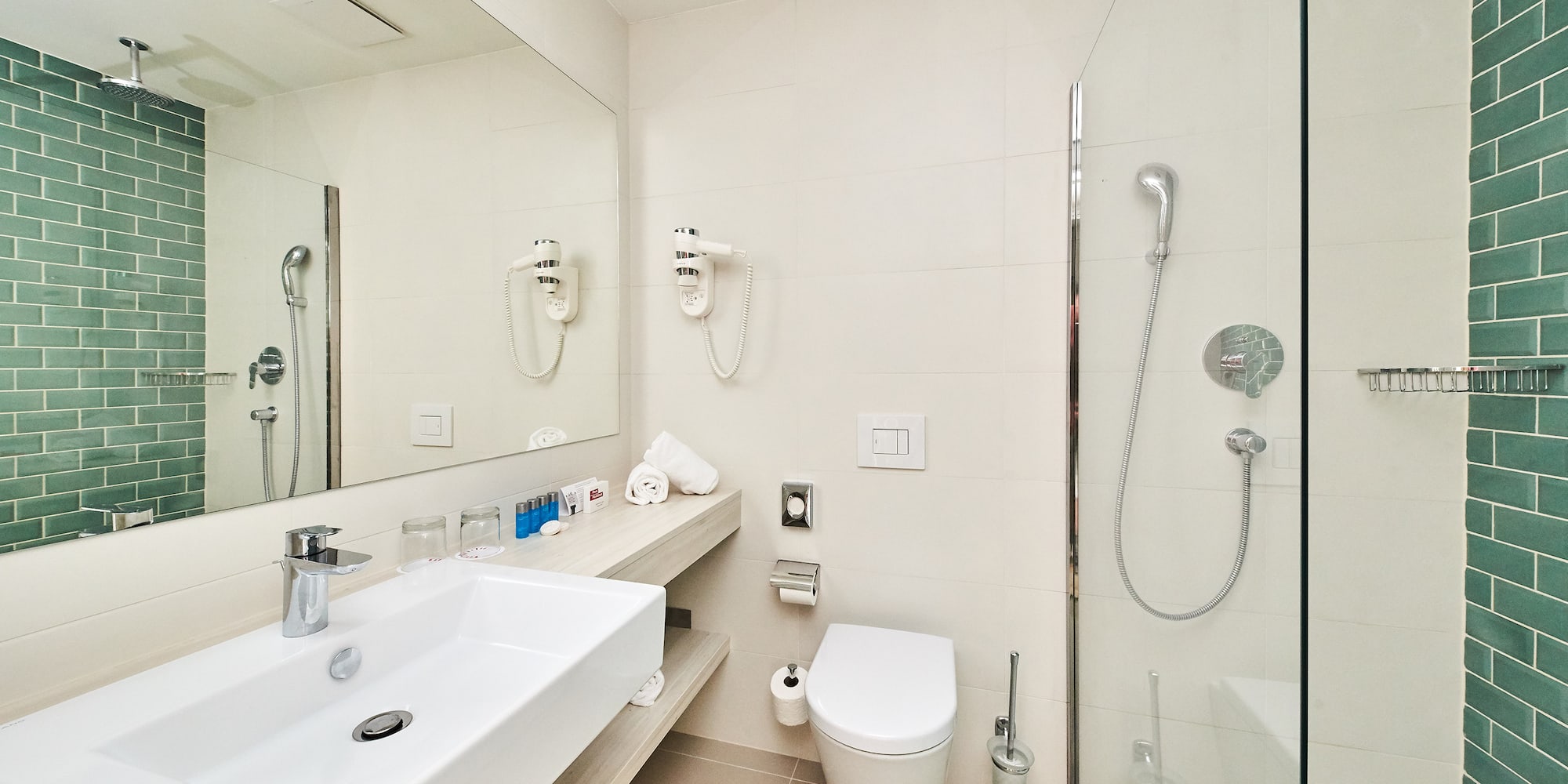 a bathroom with a shower and sink